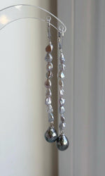 Tahitian pearl drop earrings with reflective green tones and leverback fastenings.