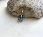 Crystal-accented sterling silver pendant featuring a lustrous Tahitian pearl.