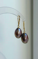 Warm rose gold Edison pearls with a reflective surface