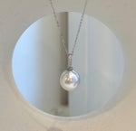 White South Sea pearl pendant with mirror luster and a sterling silver fitting.