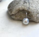 White pearl pendant combining reflective South Sea pearl luster with sterling silver.