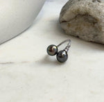 Adjustable S925 sterling silver ring featuring a pair of genuine Tahitian pearls.