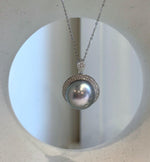 S925 sterling silver pendant showcasing a silver-blue Tahitian pearl surrounded by sparkling clear stones.