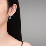 Elegant S925 silver earrings with one carat moissanite center stone each