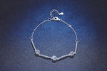 Round 5mm moissanite stones set in a sterling silver bracelet