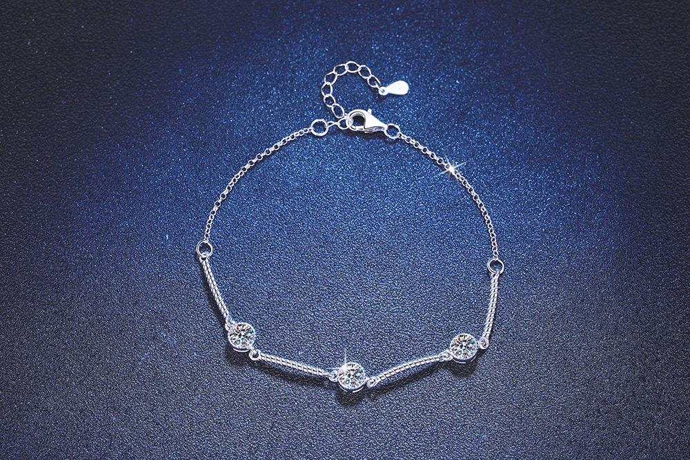 Round 5mm moissanite stones set in a sterling silver bracelet
