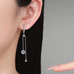 Moissanite hoop earrings with delicate dangling chains and silver bead ends