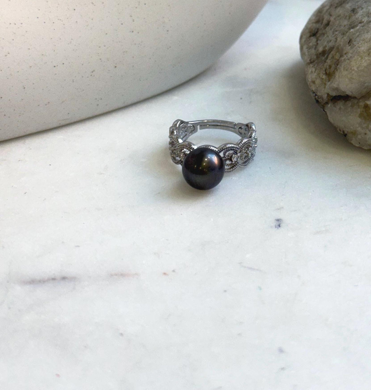 Close-up of a black platinum Tahitian pearl on a gold-plated sterling silver ring