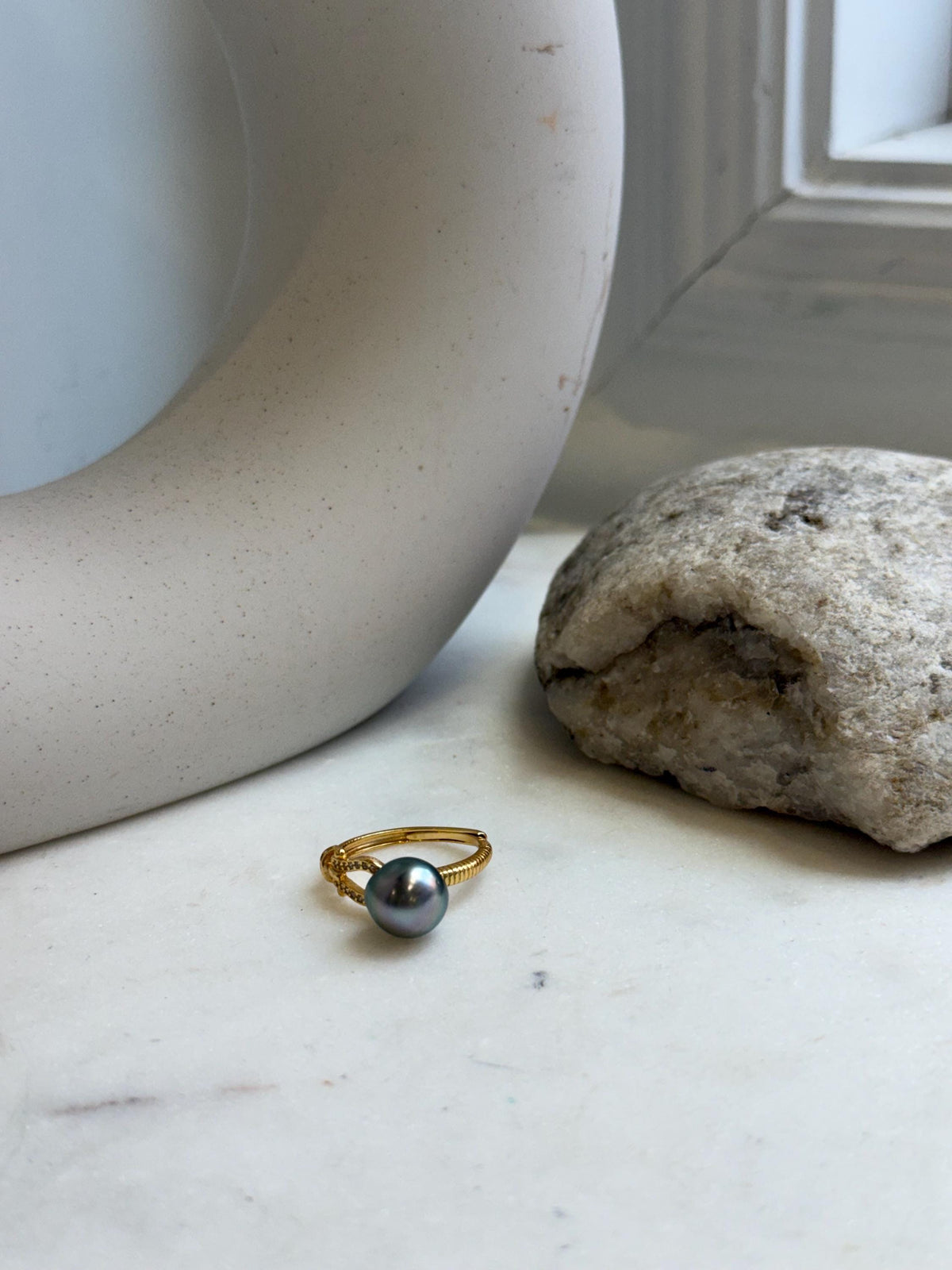 Tahitian saltwater pearl ring with a dark green pearl and gold-tone band