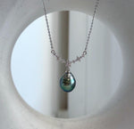 Peacock green Tahitian pearl necklace with a teardrop pearl beneath sparkling floral details in S925 sterling silver.