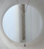 Lustrous drop-shaped Tahitian pearl paired with clear stone accents and S925 sterling silver.
