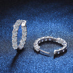 Round brilliant moissanite stones set along the front and inner back.