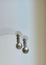 Pair of lustrous 9mm gray pearls with soft green and golden reflections beneath sterling silver links.