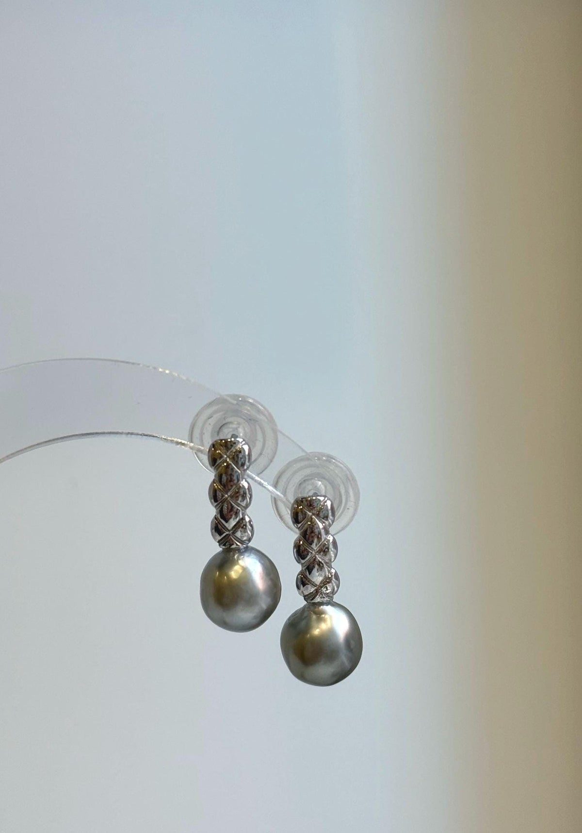 Pair of lustrous 9mm gray pearls with soft green and golden reflections beneath sterling silver links.