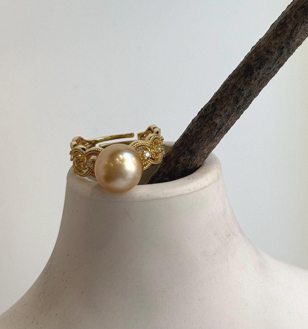 South Sea pearl ring pairing a rich tea-gold pearl with an adjustable lace-design band in gold-plated sterling silver.