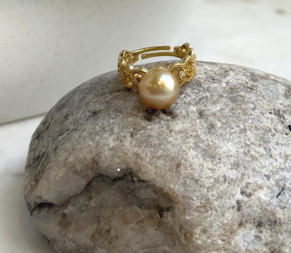 Elly’s minimalist pearl ring with a lustrous 10.2mm South Sea pearl and delicate gold-plated S925 silver lace detailing.