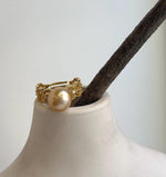 Golden South Sea pearl ring with a highly lustrous surface and a delicate lace-style setting on an adjustable S925 silver band.
