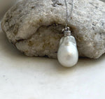 Australian saltwater pearl pendant featuring extreme luster and white silver tones.