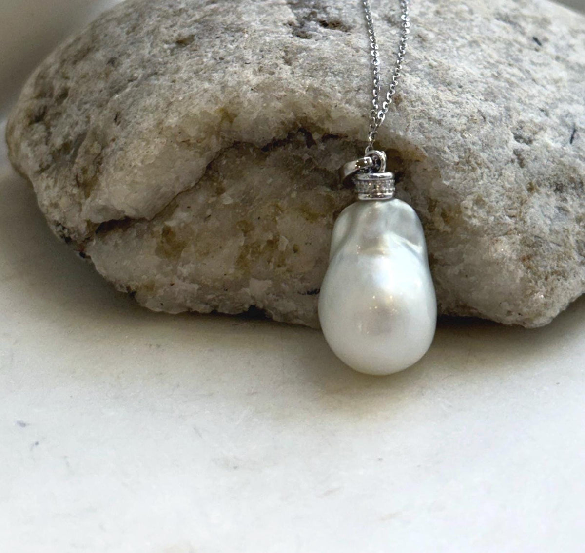Australian saltwater pearl pendant featuring extreme luster and white silver tones.