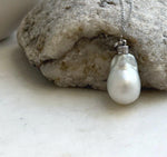 Australian white pearl pendant with silver tones and a distinctive statement design.