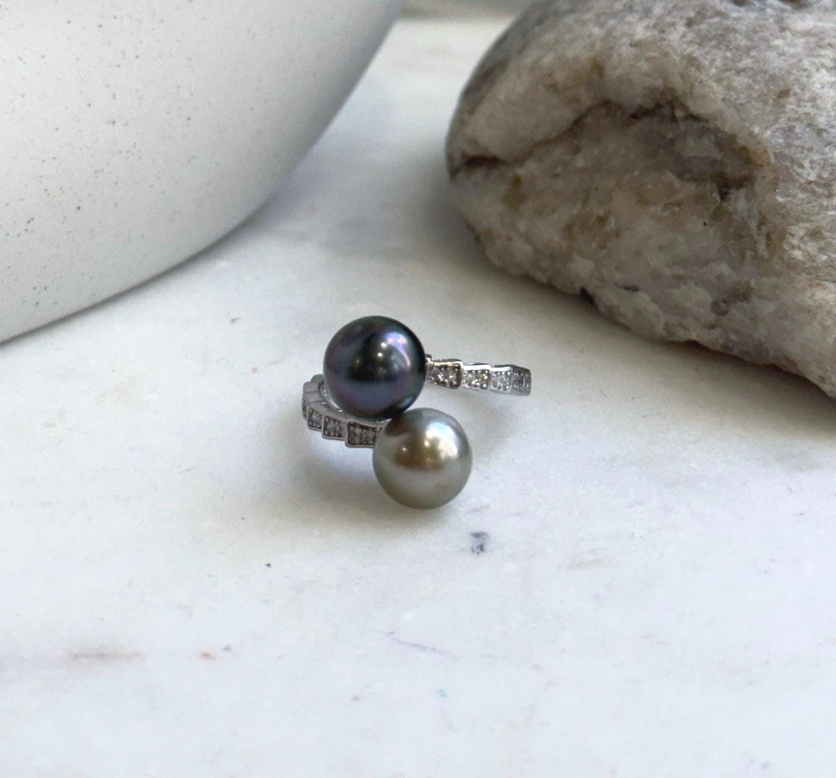 Genuine saltwater pearls with taupe green tones featured in a double pearl silver ring.