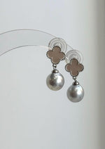 Genuine South Sea pearl earrings featuring soft silver-white tones and luminous lustre.