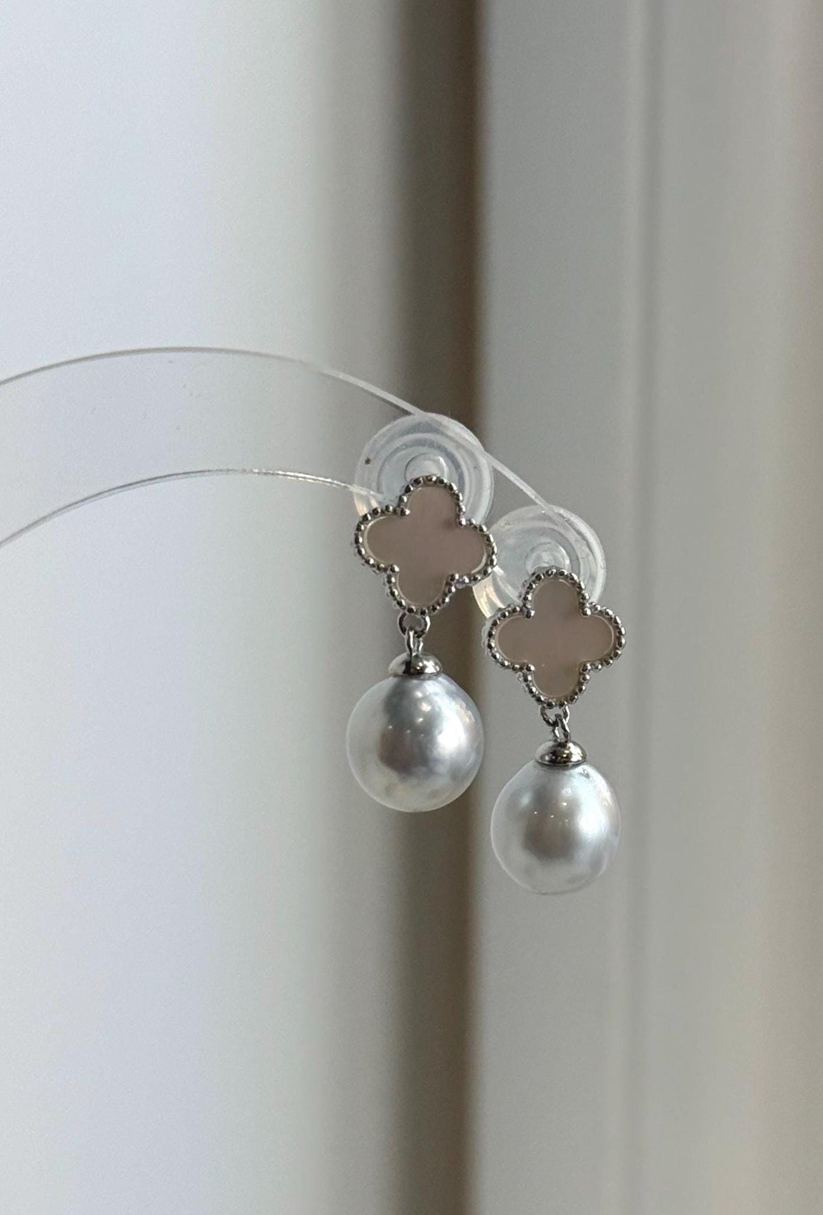 Clover S925 sterling silver earrings with dangling Australian South Sea pearls.