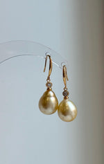 11.6mm golden pearls suspended from S925 sterling silver hooks.
