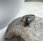Tahitian saltwater pearl with blue-green overtones on a sparkling silver band.