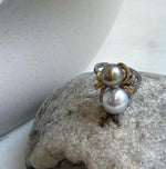 8.9–9.9mm Tahitian pearls with mirror luster in a floral silver ring.