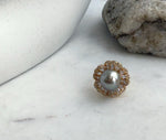 Reflective taupe Tahitian pearl set in a gold-plated sterling silver flower ring.