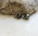 Sterling silver necklace showcasing two genuine Tahitian pearls with brilliant luster.