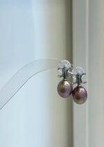 Lavender Edison pearls with rose overtones paired with sterling silver settings.