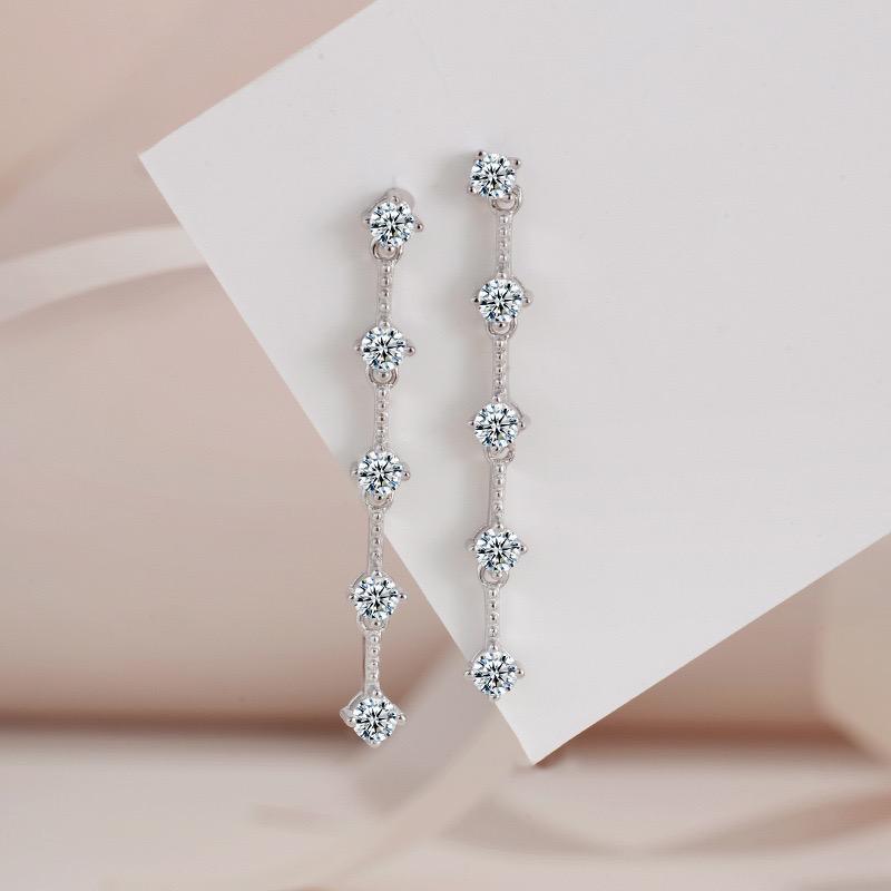 Five-stone moissanite linear drop earrings with round stones linked by S925 sterling silver chains.
