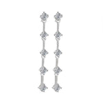 Round brilliant-cut moissanite stones connected by fine silver links in matching drop earrings.
