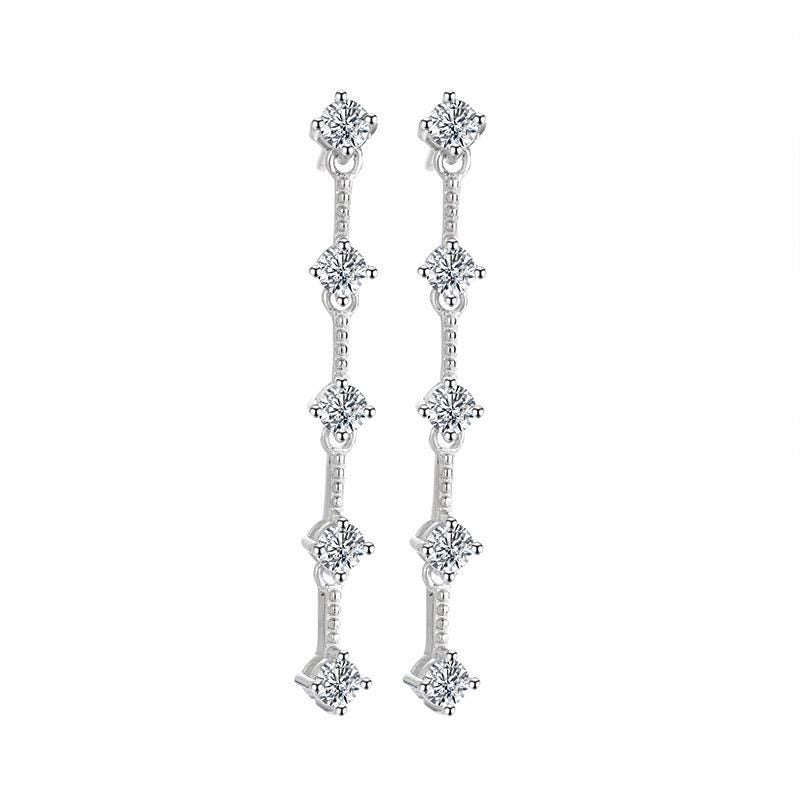 Round brilliant-cut moissanite stones connected by fine silver links in matching drop earrings.