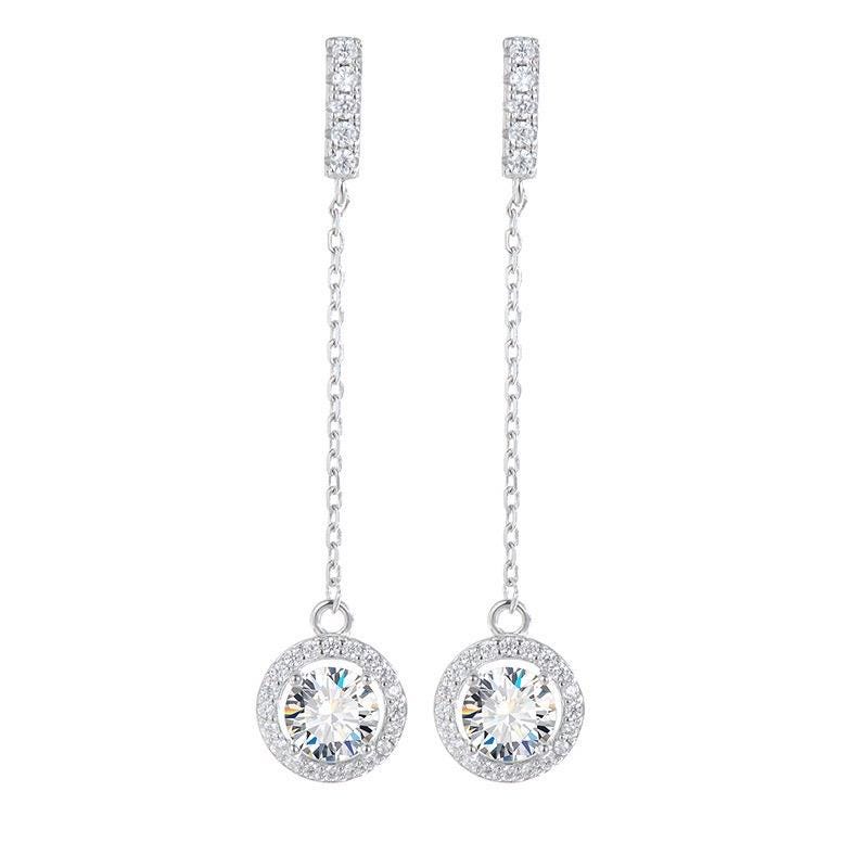 Round brilliant-cut moissanite centers surrounded by small sparkling stones on silver chain earrings.