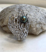 Peacock green Tahitian pearl brooch and pendant with a sculptural 3D coral design.