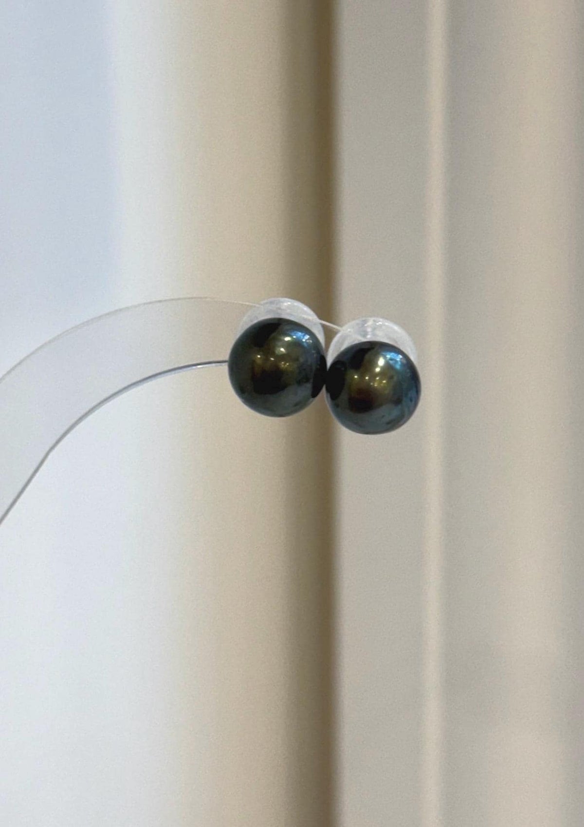 Hunter green Tahitian pearl earrings with mirror luster and geometric S925 sterling silver studs.
