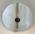 Piano black Tahitian pearl pendant with mirror luster and a minimalist S925 sterling silver setting.