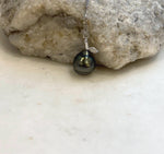 Dark Tahitian pearl necklace featuring green and gold reflections and an S925 sterling silver setting.