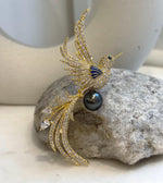 Tahitian black pearl bird brooch that also converts into a pendant, chain not included.