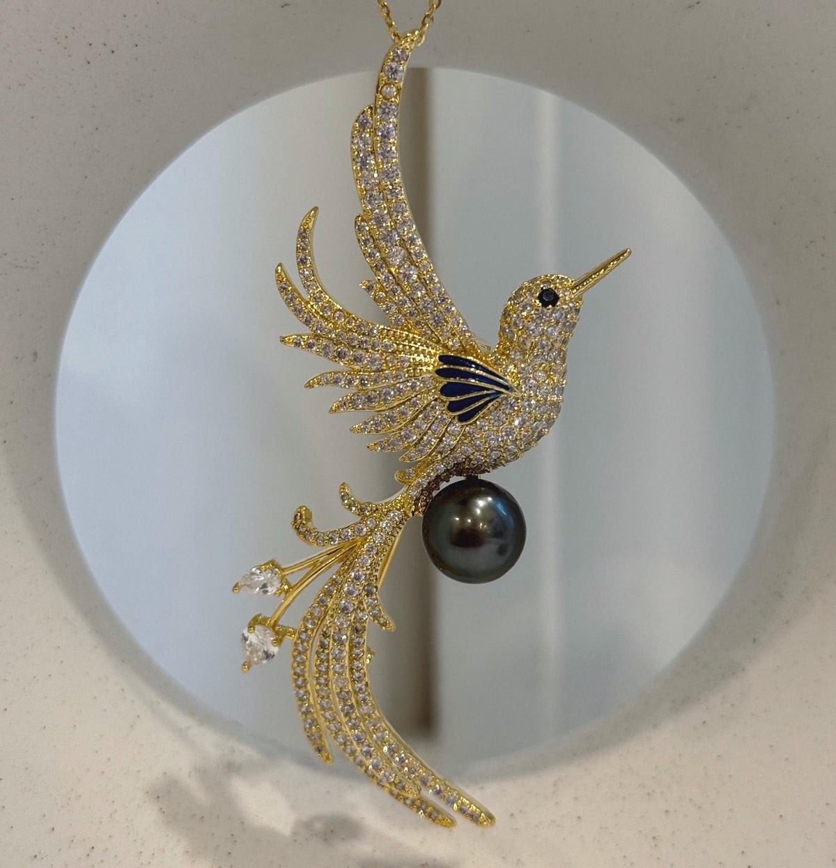 Tahitian pearl bird jewelry with a convertible two-in-one brooch and pendant design.