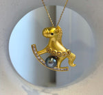 Tahitian pearl pendant brooch combining a playful horse design with sparkling clear accents.