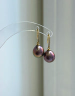 Pearl jewelry set combining a raspberry rose pendant and dangling hook earrings.