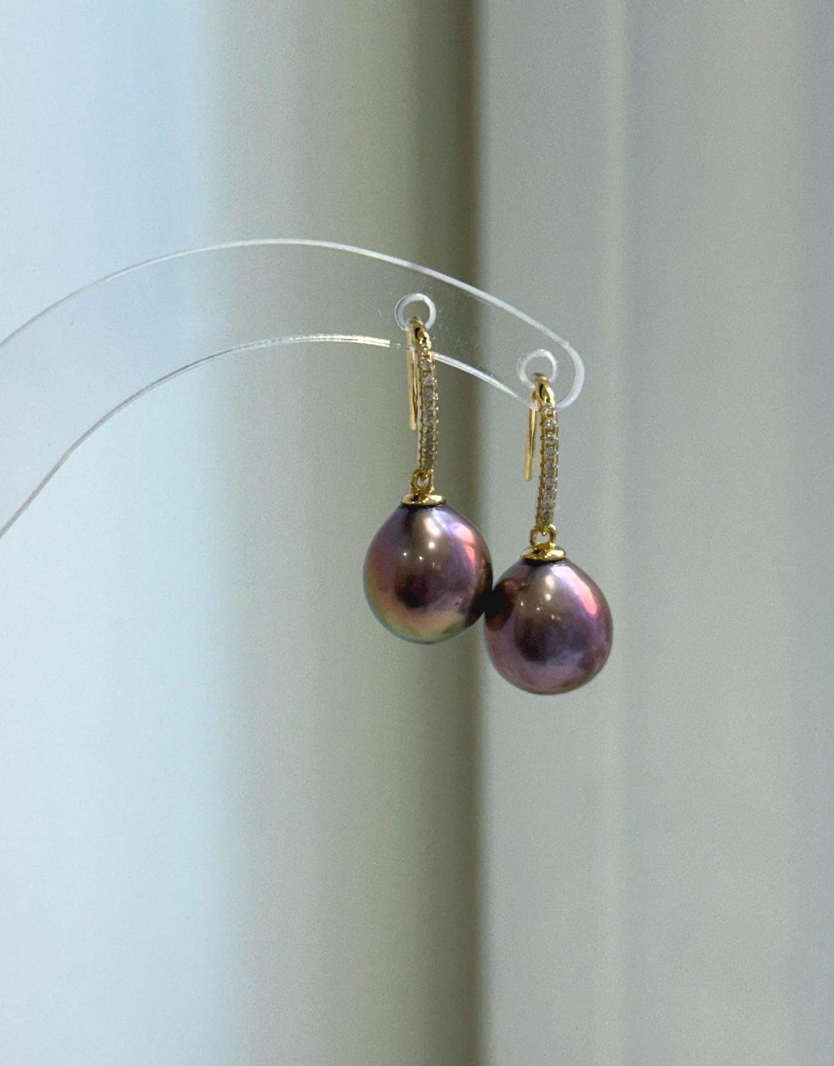Pearl jewelry set combining a raspberry rose pendant and dangling hook earrings.