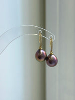 Lustrous raspberry rose pearls form the focal points of this necklace and earring set.