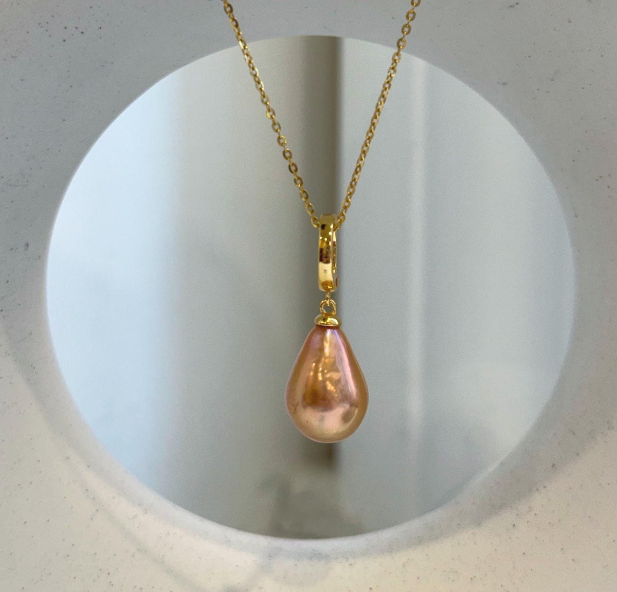Close-up of peach gold pearls showing their lustrous surfaces and warm hues.