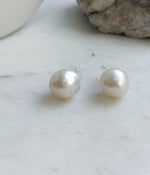 Elegant South Sea pearl stud earrings with a clean design and luminous white finish.