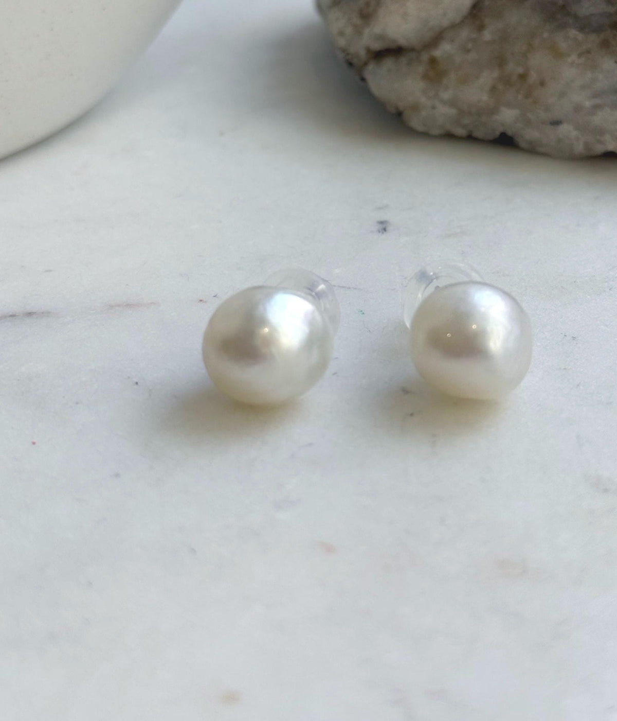 Elegant South Sea pearl stud earrings with a clean design and luminous white finish.